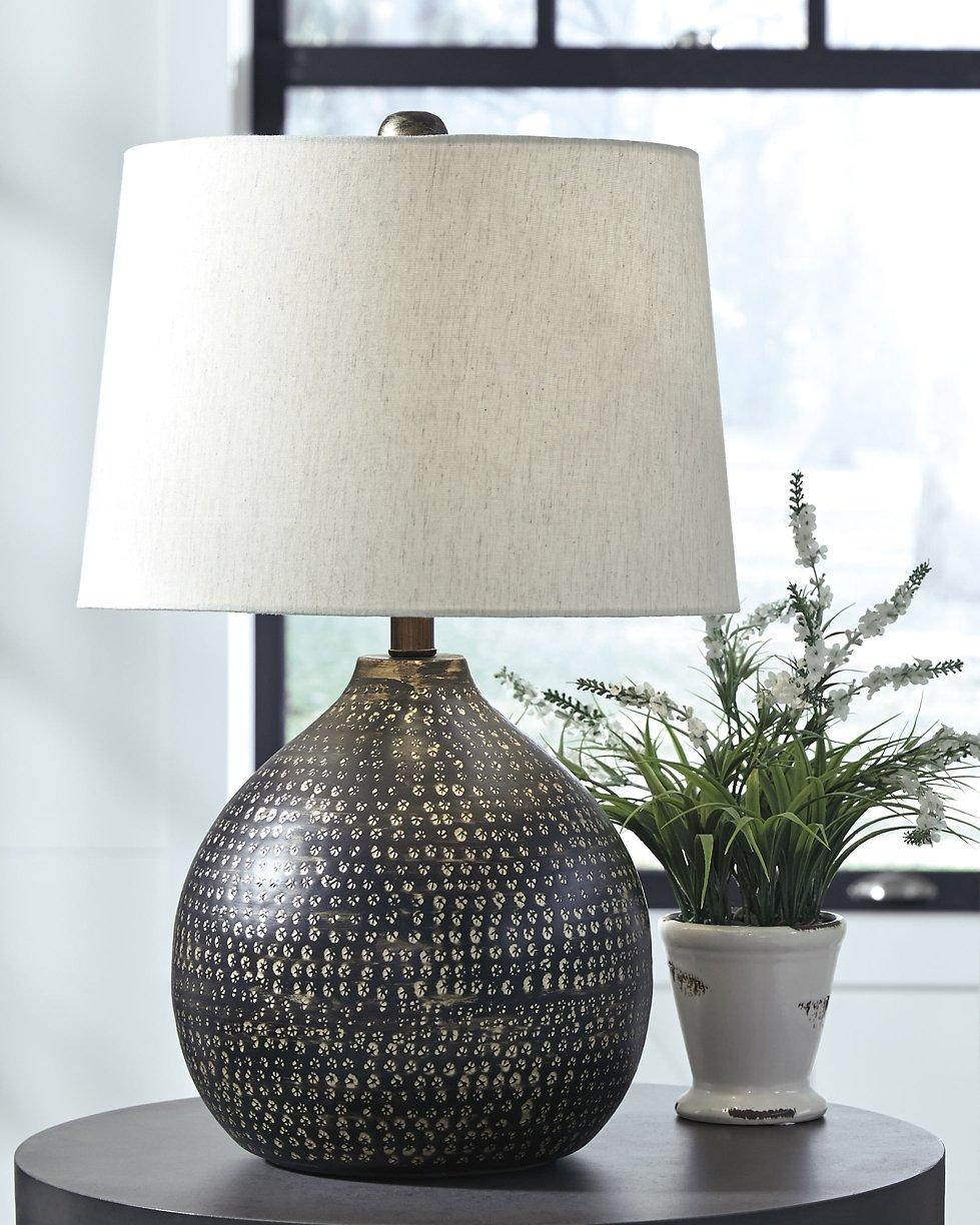Maire Table Lamp by Ashley Furniture featuring a sleek design and fabric shade on a modern base, perfect for living room or bedside.