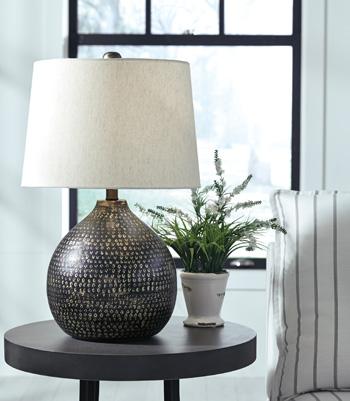 Maire table lamp by Ashley Furniture featuring a modern design with a sleek base and fabric shade, perfect for living room lighting.