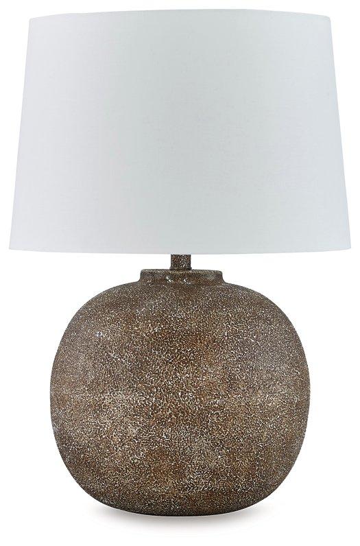 Neavesboro Ashley Furniture table lamp with a classic design featuring a fabric shade and wooden base on a wooden table.