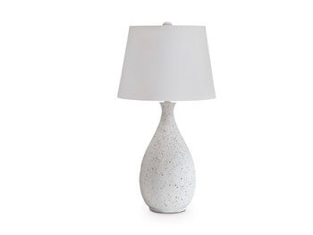 Ashley Furniture Wyattford table lamp with a sleek base and fabric shade, perfect for modern bedroom or living room decor.