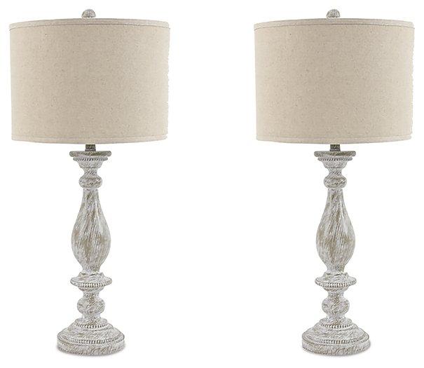 Pair of Ashley Furniture Bernadate table lamps with beige fabric shades and ceramic bases on a wooden surface.