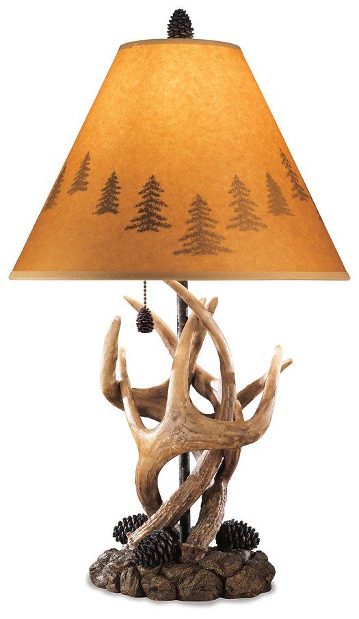 Pair of Ashley Furniture Derek table lamps with beige fabric shades and elegant ceramic bases on a wooden surface.