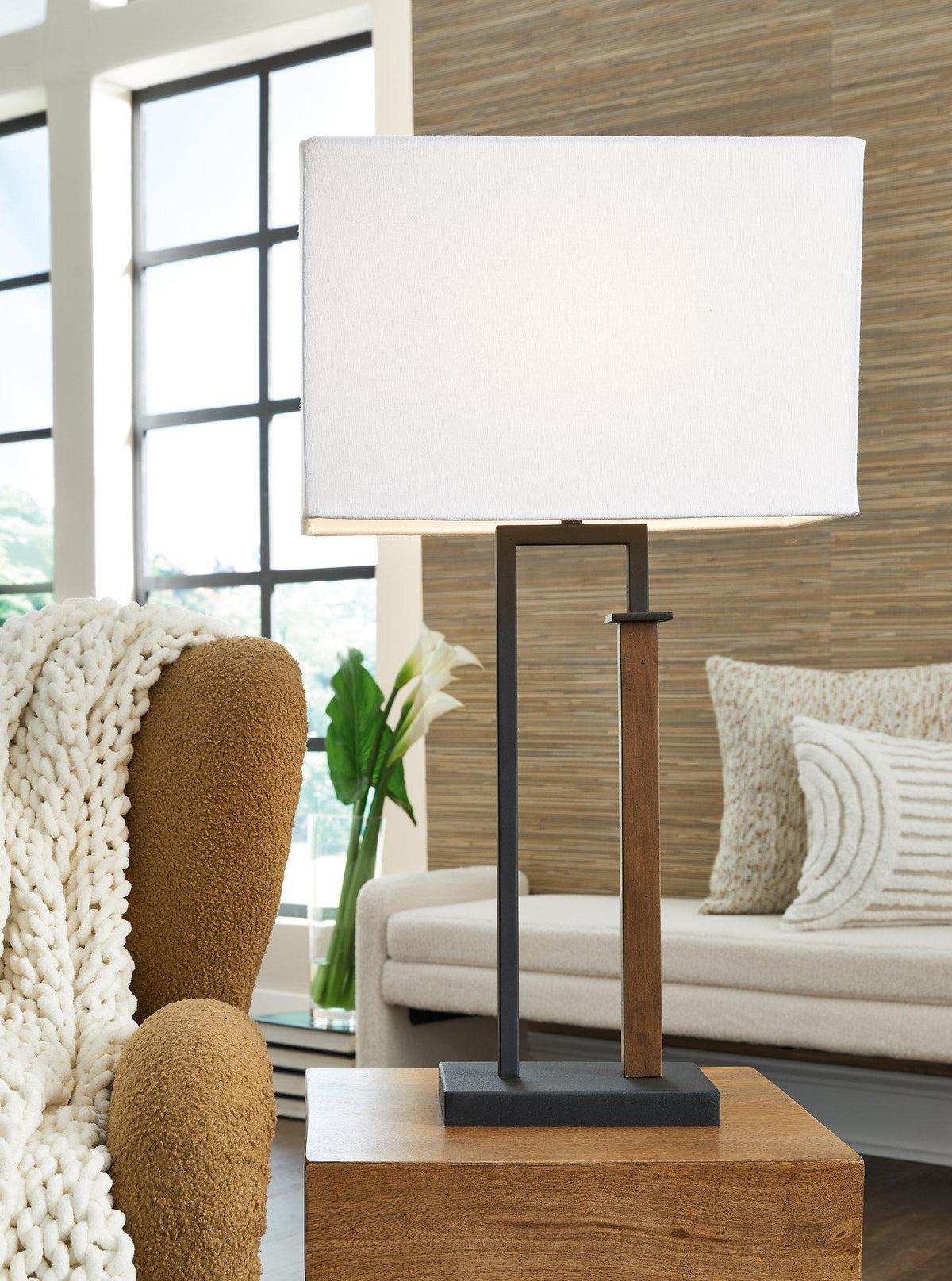 Pair of Ashley Furniture Voslen table lamps with beige fabric shades and wooden bases, perfect for bedside or living room lighting.