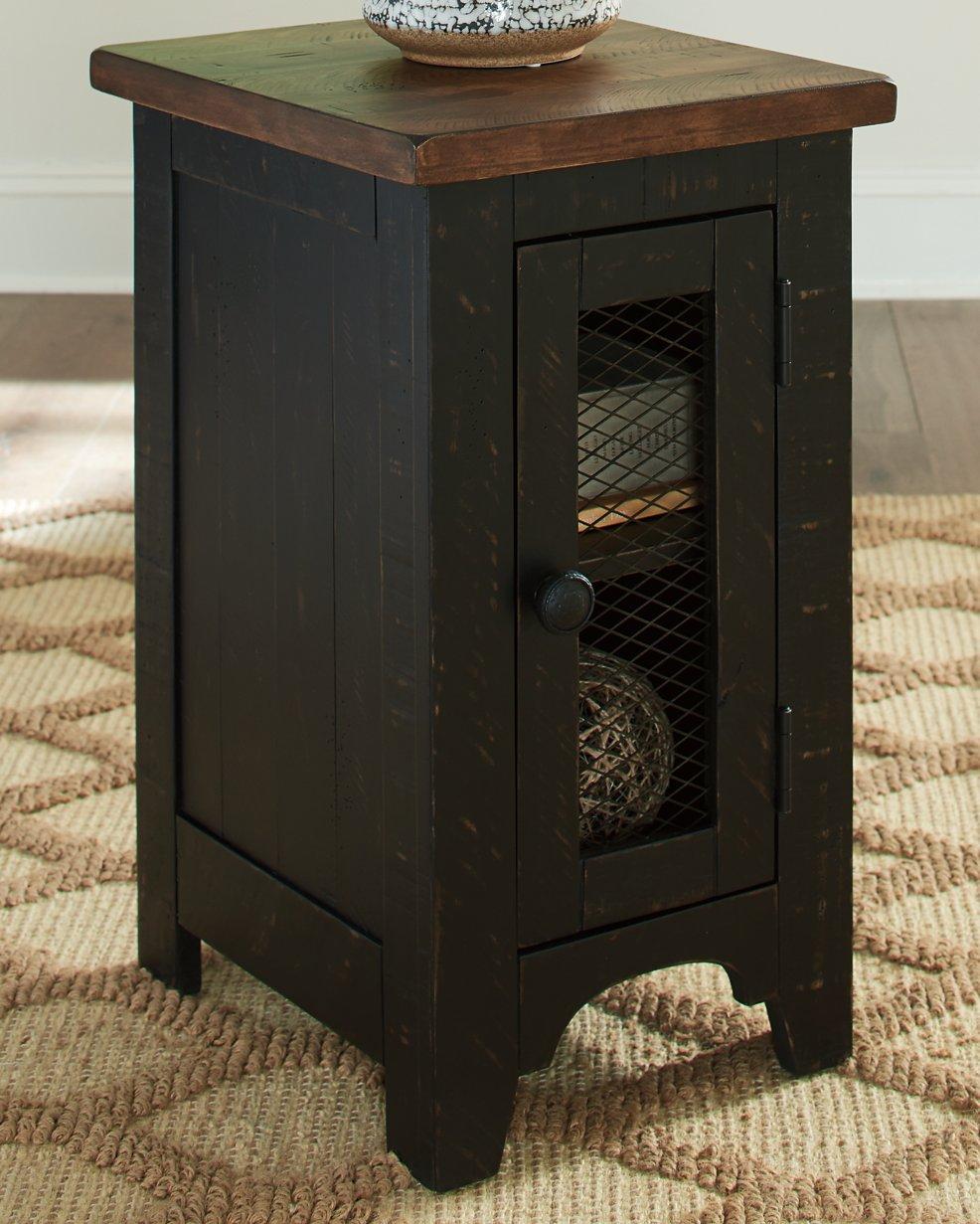 Set of two Ashley Furniture Valebeck End Tables with wood finish and simple rectangular design, placed beside a sofa.