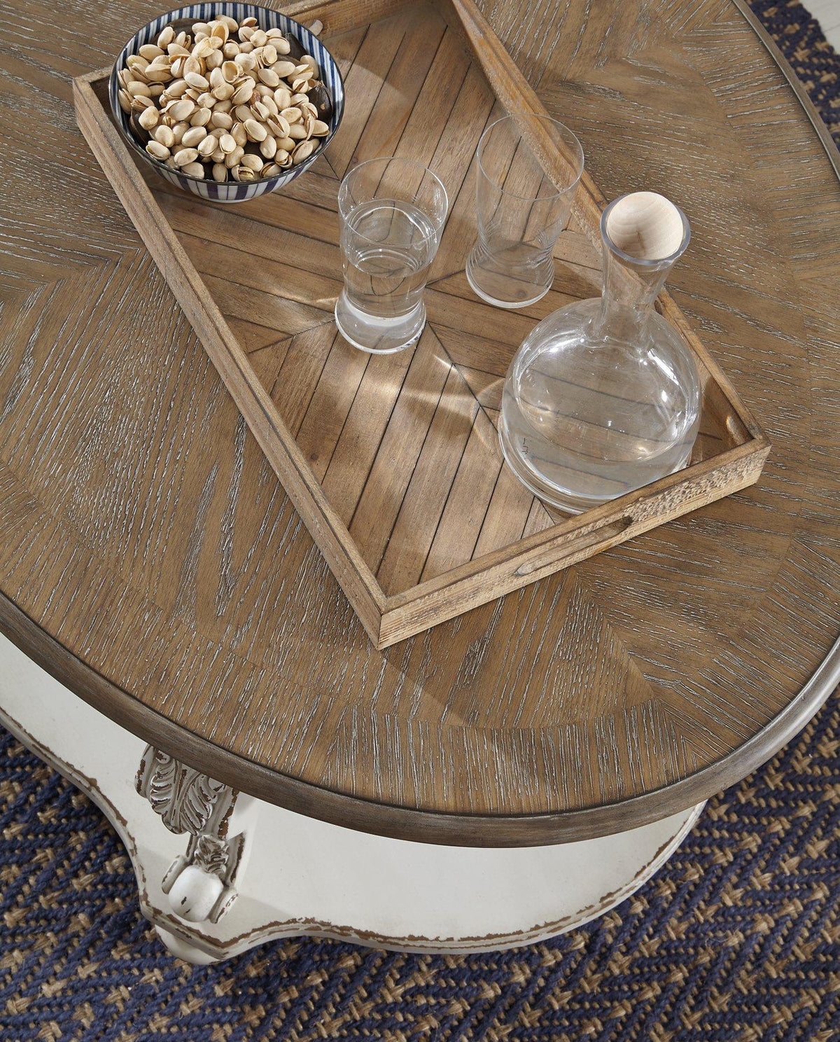 Ashley Furniture Realyn Table Set with a wooden table and matching chairs, showcasing a modern dining room design.