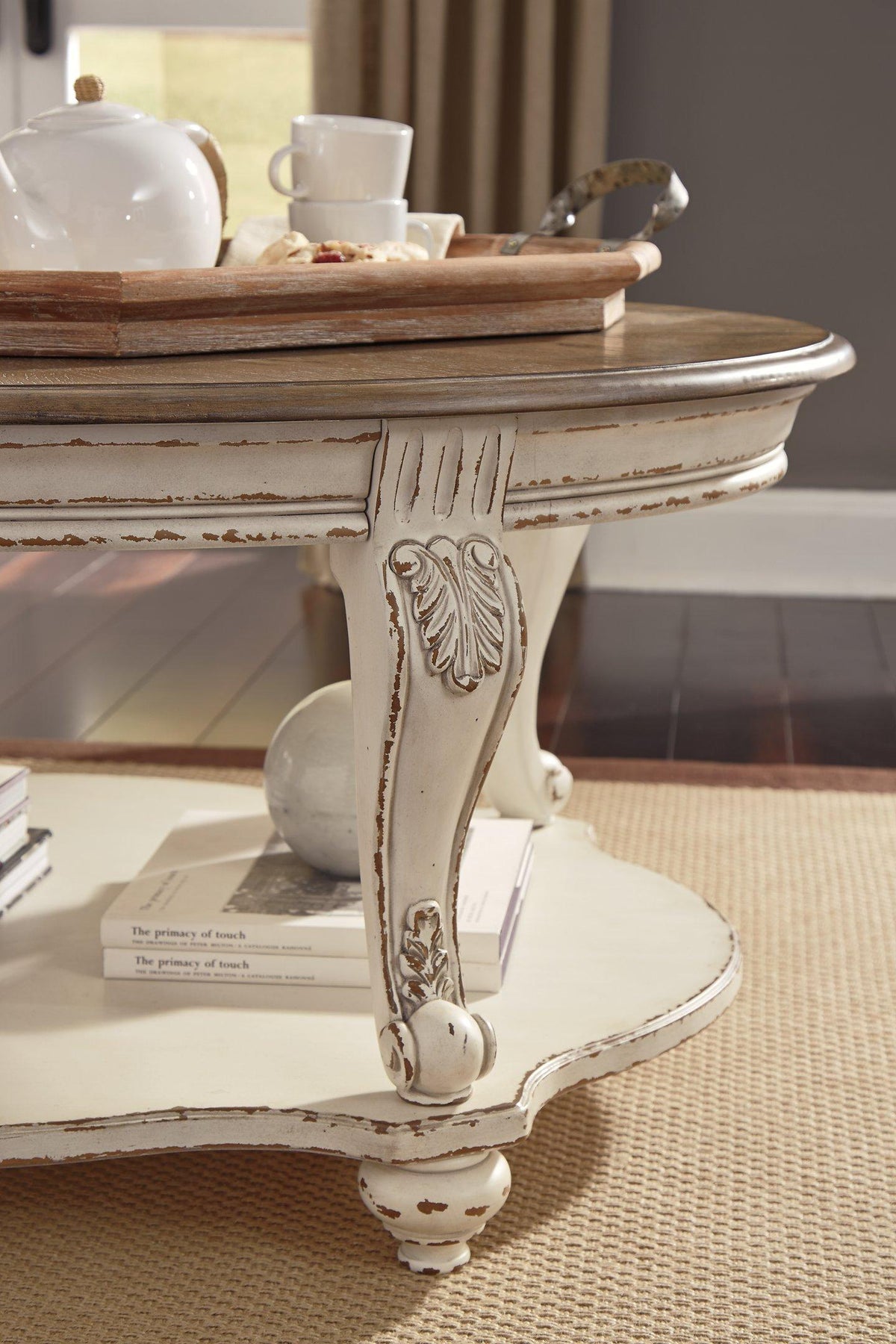 Ashley Furniture Realyn Table Set featuring a wooden dining table with matching chairs and a modern, elegant design.