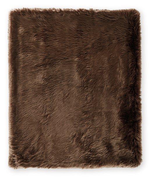 Set of three Ashley Furniture Bellethrone throws with soft fabric and decorative fringes, perfect for cozy living room decor.