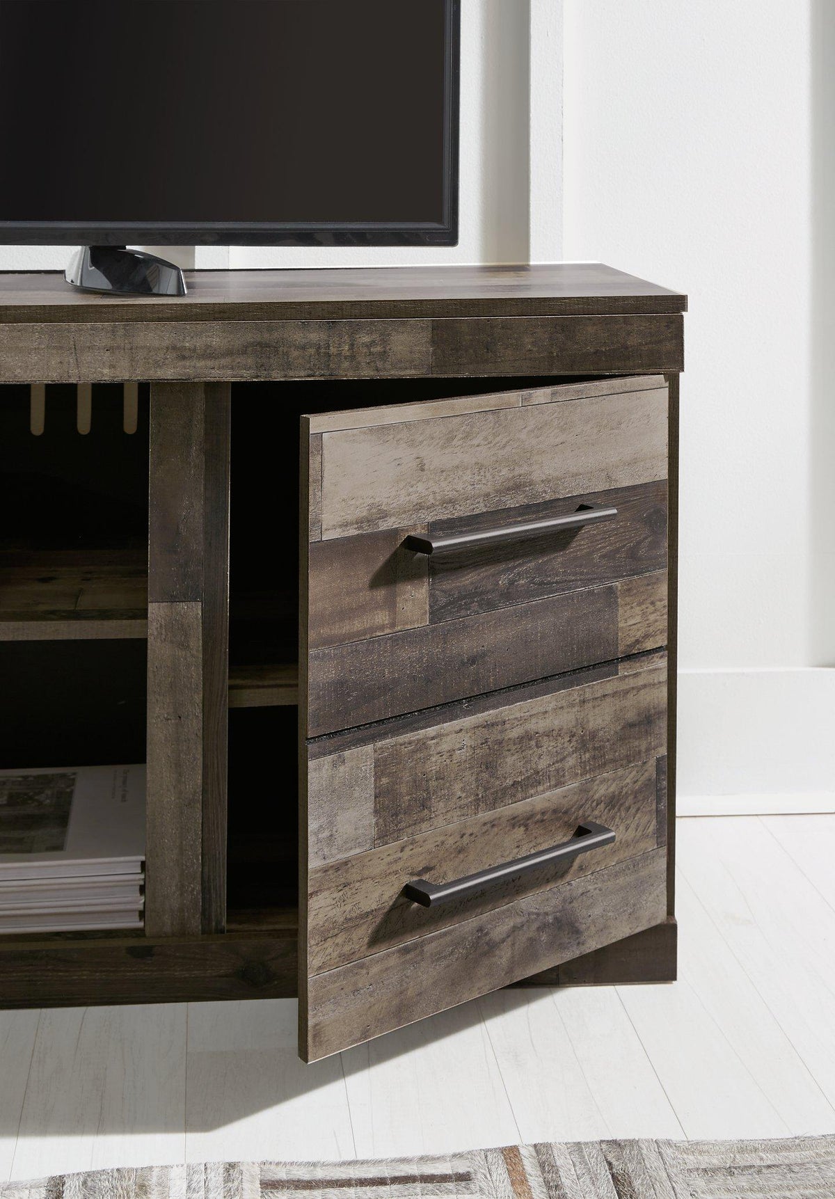 Ashley Furniture Derekson TV Stand with electric fireplace, featuring wood finish, storage cabinets, and a built-in fireplace.