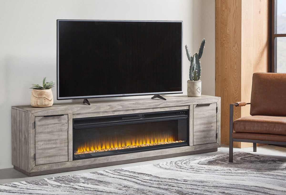 Ashley Naydell 92-inch TV stand with built-in electric fireplace, featuring a modern wood finish and ample storage compartments.