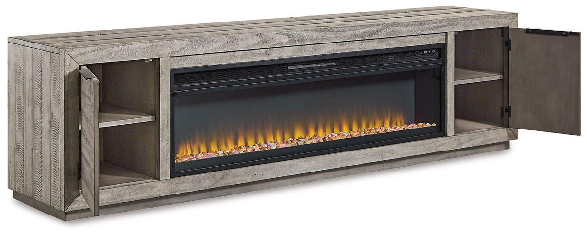 Naydell 92-inch TV stand by Ashley Furniture with built-in electric fireplace, modern wooden design with ample storage space.