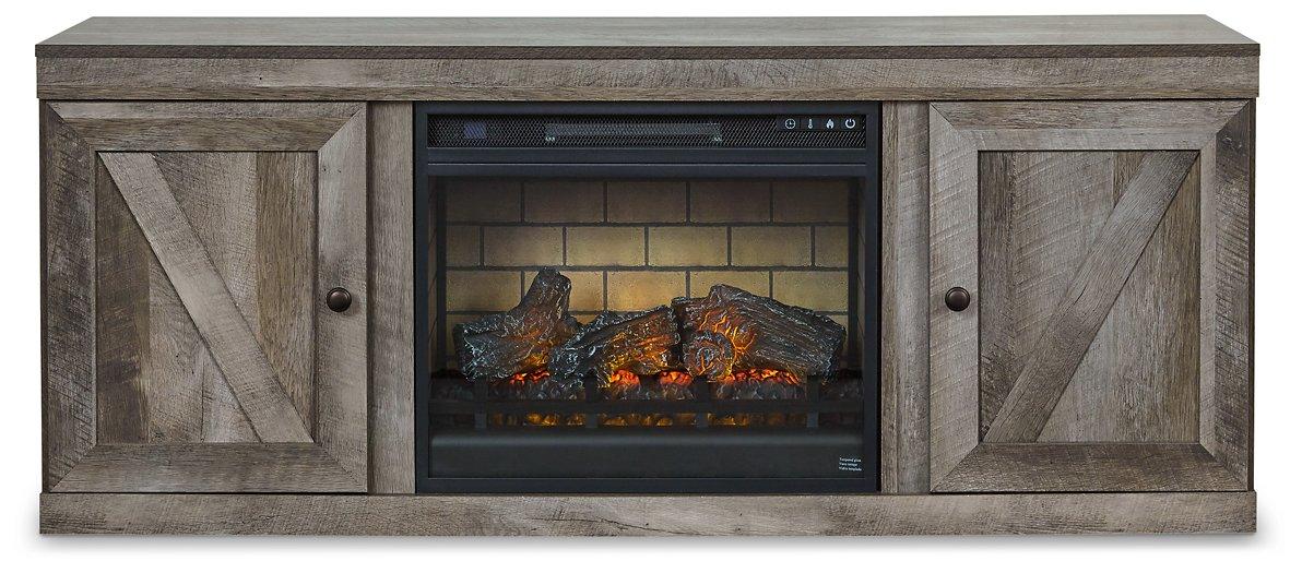 Ashley Furniture Wynnlow TV Stand with electric fireplace, dark wood finish, and storage cabinets for entertainment setup.