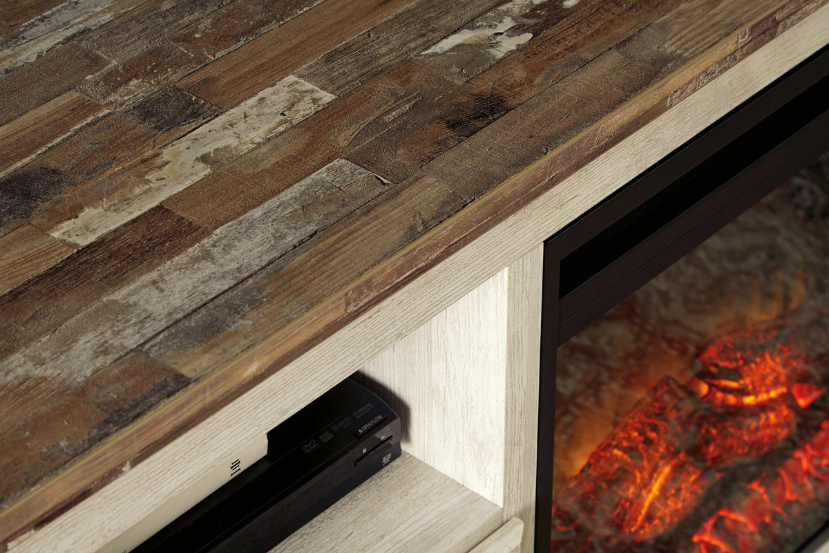 Willowton 64-inch TV stand with electric fireplace from Ashley Furniture, featuring a modern design and spacious storage compartments.