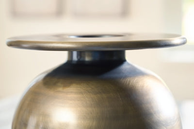 Ashley Furniture Fedorleigh vase with intricate design, showcasing a stylish ceramic vase suitable for home decor.