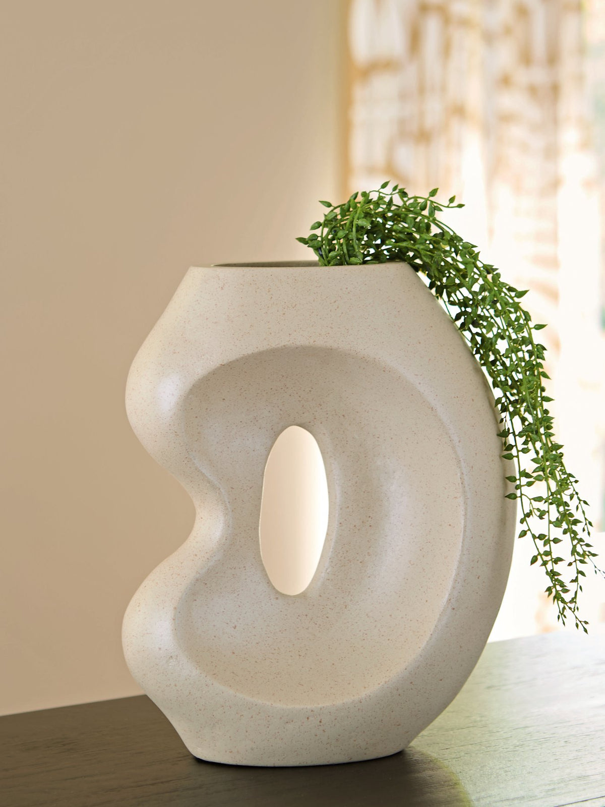 Ashley Furniture Odion Vase with a sleek, modern design and textured surface, perfect for decorative accents in living spaces.