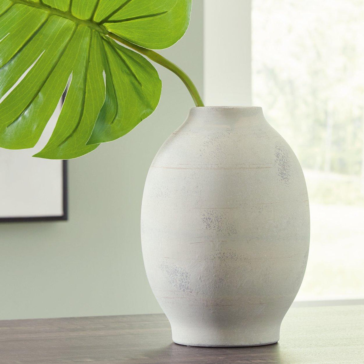 Elegant Clayson Vase by Ashley Furniture featuring a sleek ceramic design with a glossy finish, perfect for decorative display.