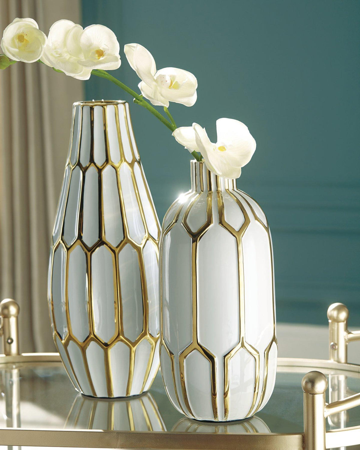 Set of two Mohsen vases by Ashley Furniture, featuring sleek ceramic design with modern curves and neutral finish.