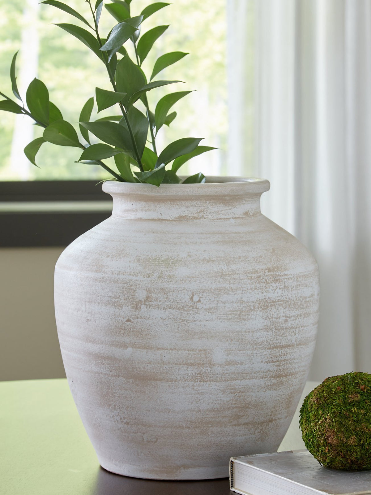 Ashley Furniture Meadie Vase with a sleek, modern design, featuring a smooth surface and neutral color.