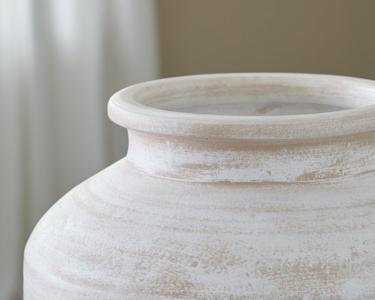 Elegant Ashley Furniture Meadie Vase with a sleek, modern design, featuring a smooth, curved surface in neutral tones.