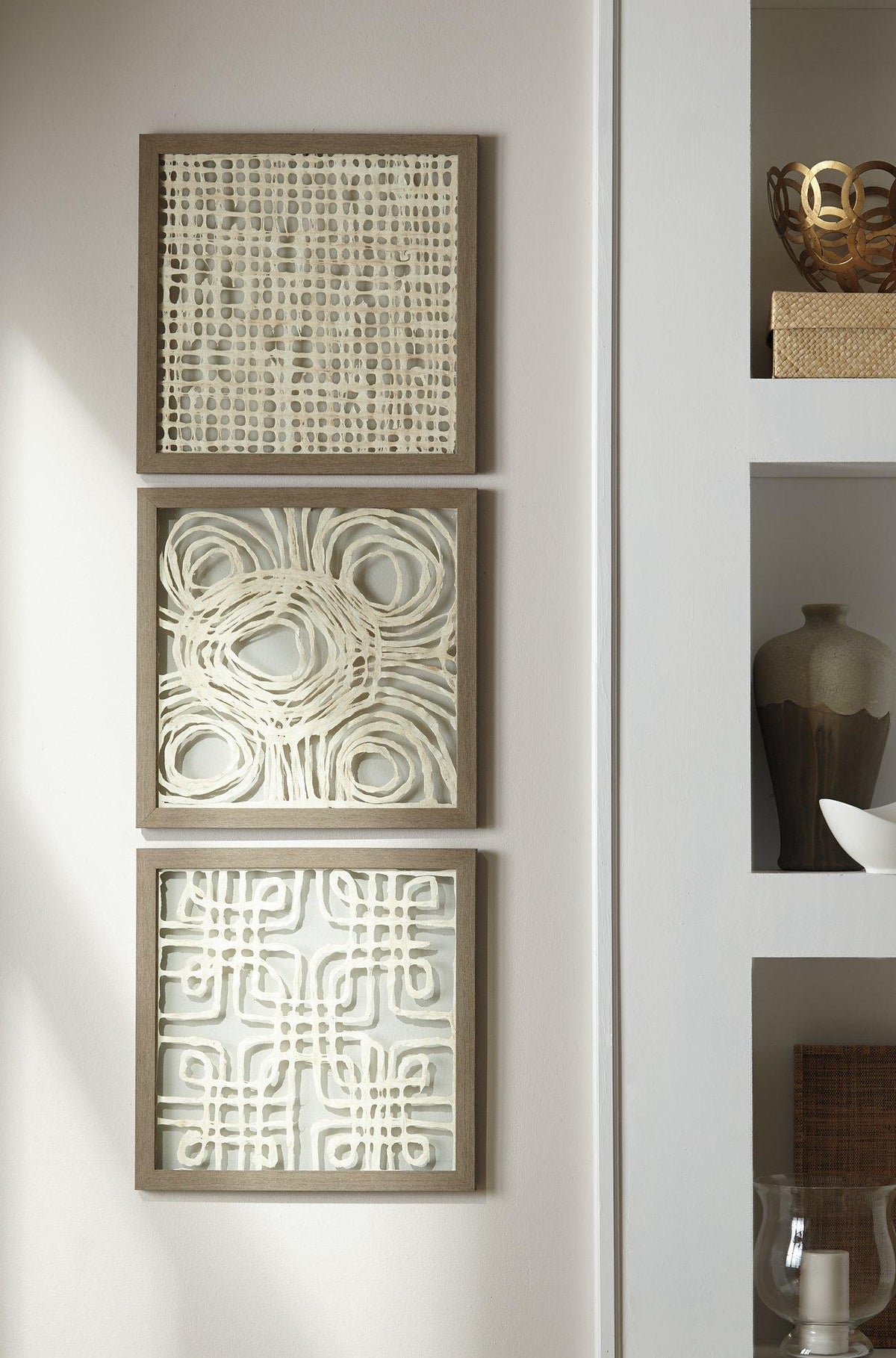 Set of three Ashley Furniture Odella wall decor pieces featuring modern abstract designs for stylish home decoration.