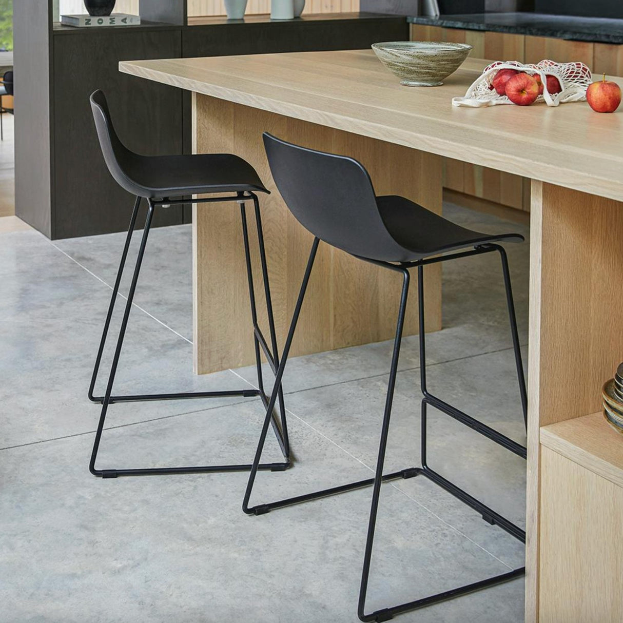 Black MCM indoor/outdoor barstool by Article with a sleek, modern design and sturdy metal frame