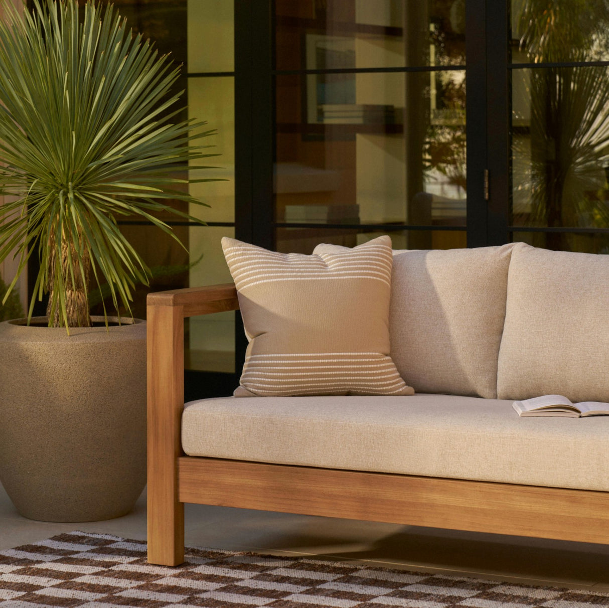 Outdoor sofa by Article, 80-inch Portside Beige outdoor sofa with plush cushions, ideal for patio or garden seating.
