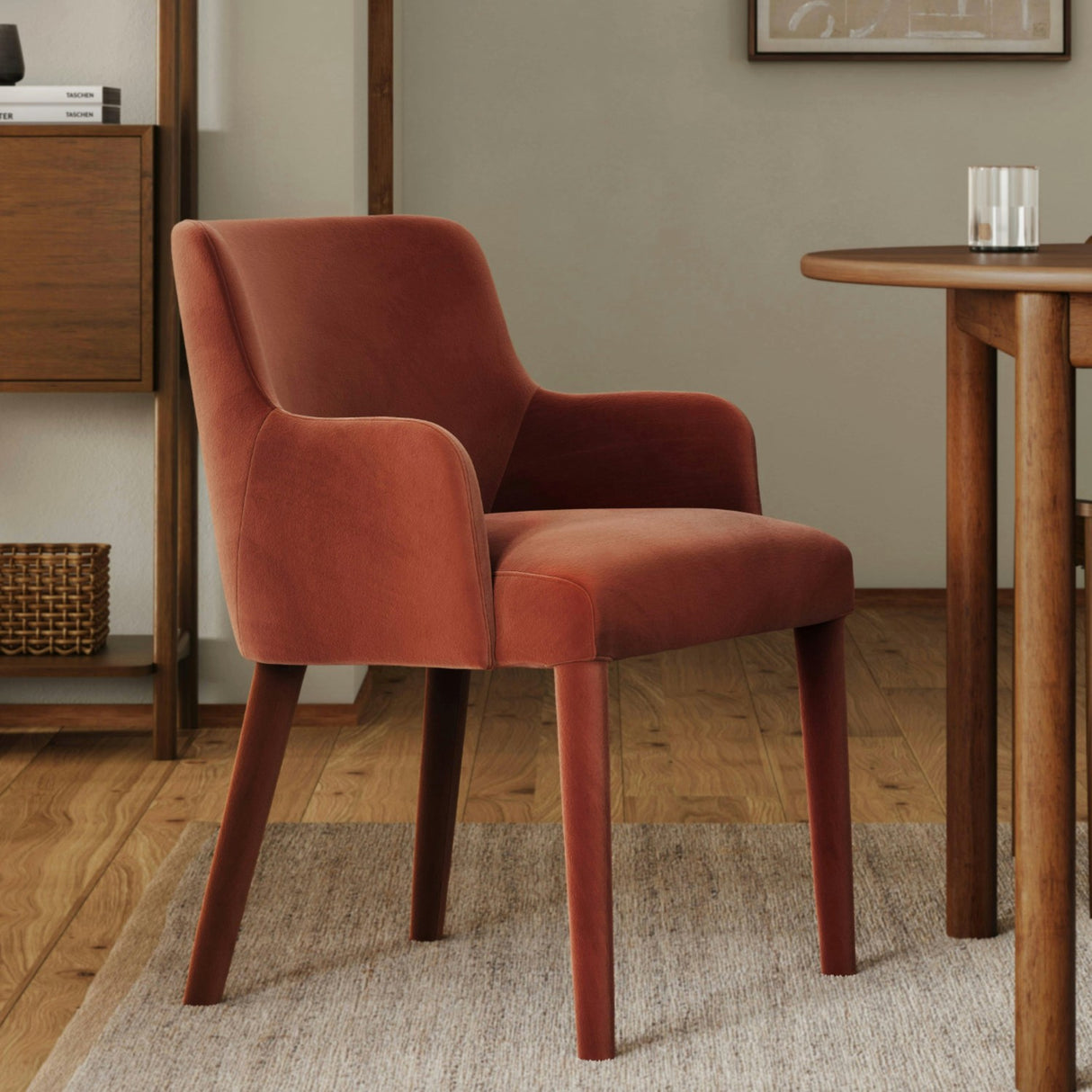 Rust velvet MCM-style armchair by Article with a sleek, mid-century modern design and plush cushioned seat.