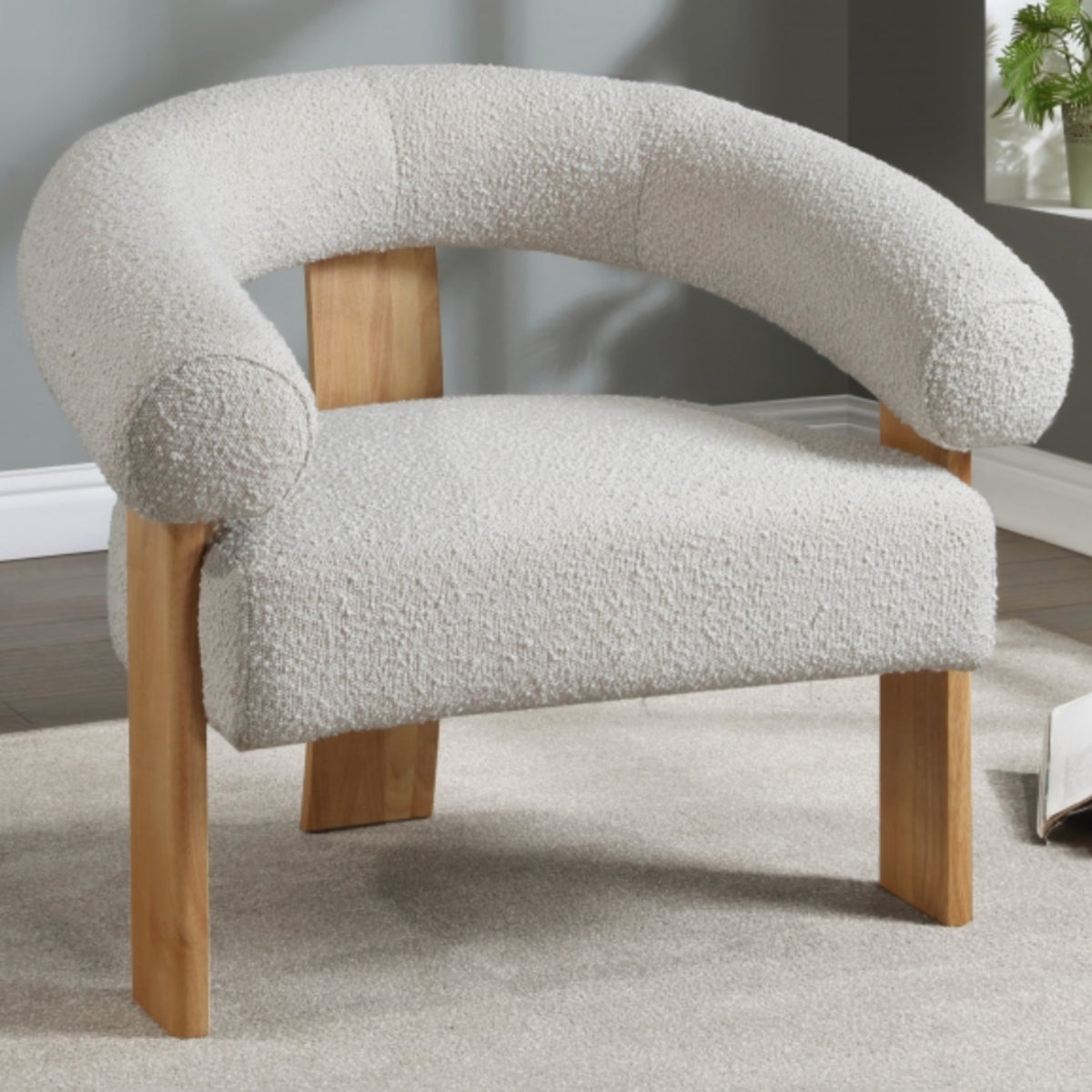 Winston MCM lounge accent chair by Meridian with bouclé fabric, featuring a modern design and plush cushioned seating.