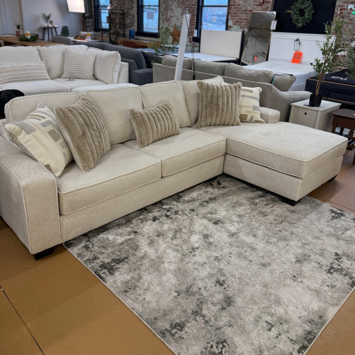 Pull Up A Couch Briarwood 2-piece sectional sofa with plush cushions and modern design in a cozy living room setting.