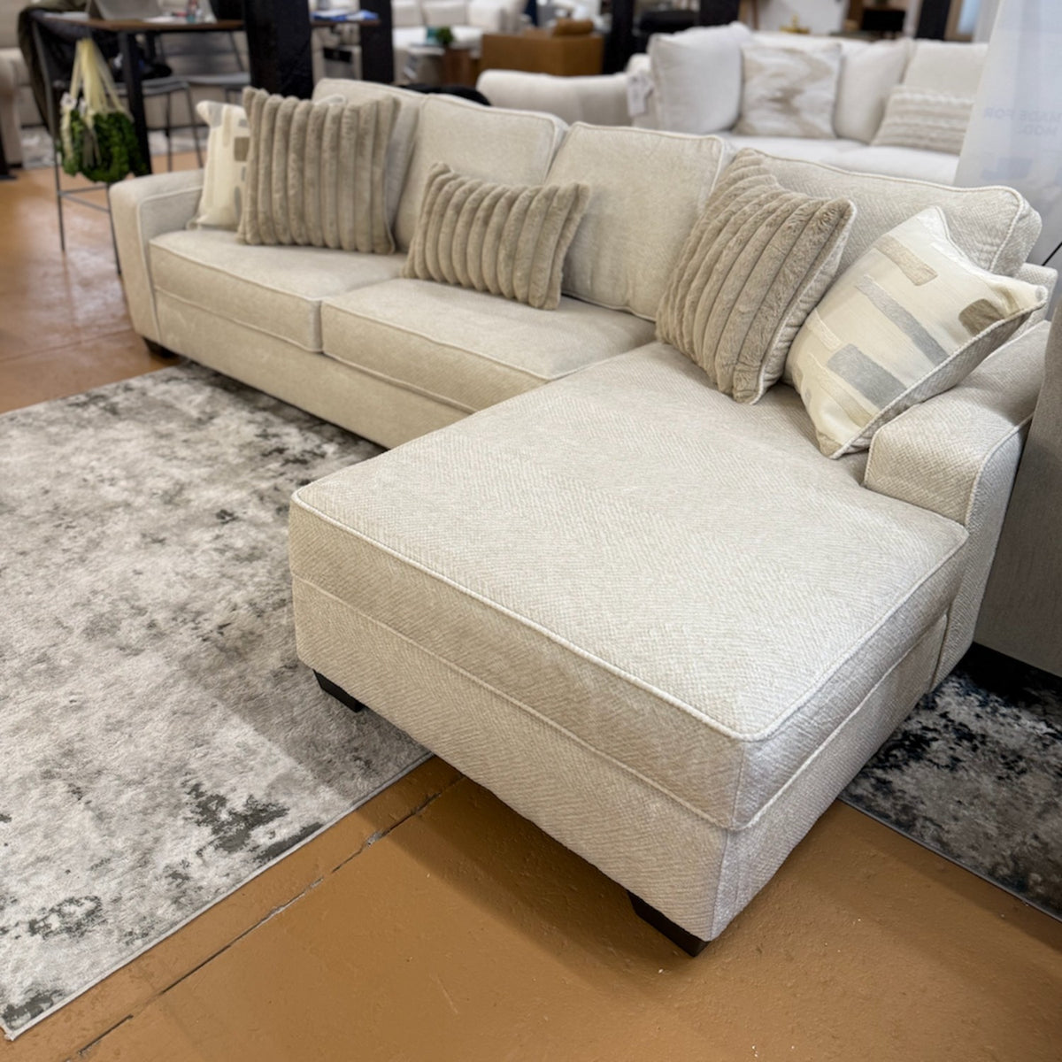 Pull Up A Couch Briarwood 2-piece sectional sofa, beige upholstery with plush cushions and modern design.