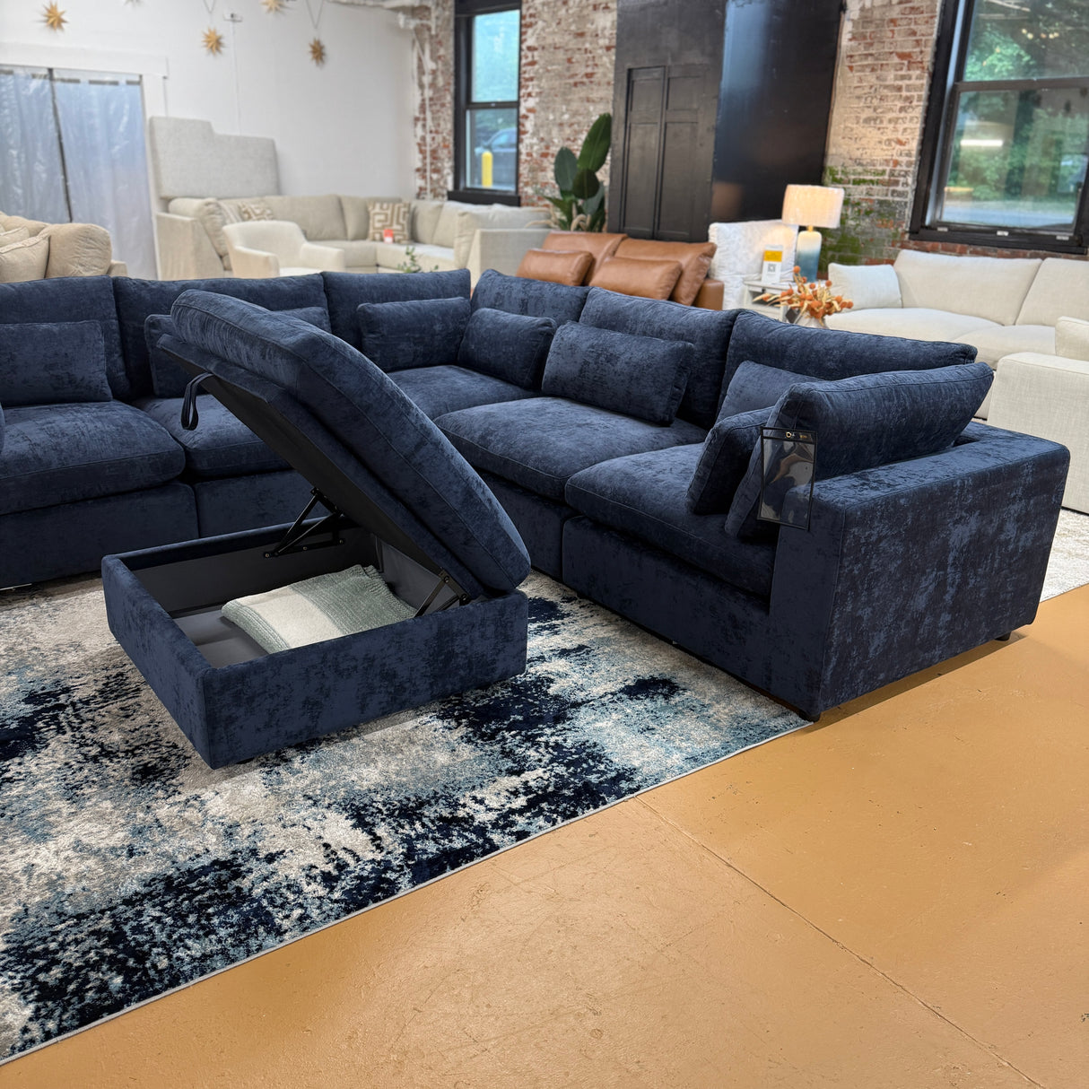 Pull Up A Couch Serenity Cloud 5-piece blue corner sectional with storage ottoman, showcasing plush upholstery and modern design.