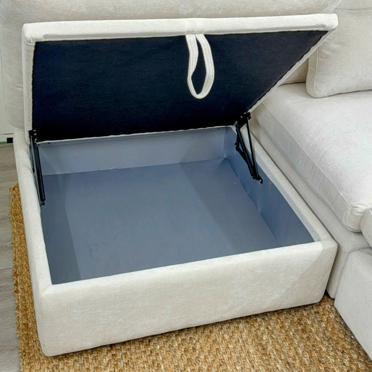 Pull Up A Couch Serenity Cloud sectional with storage ottoman, a modern 4-piece living room sofa set with plush cushions.