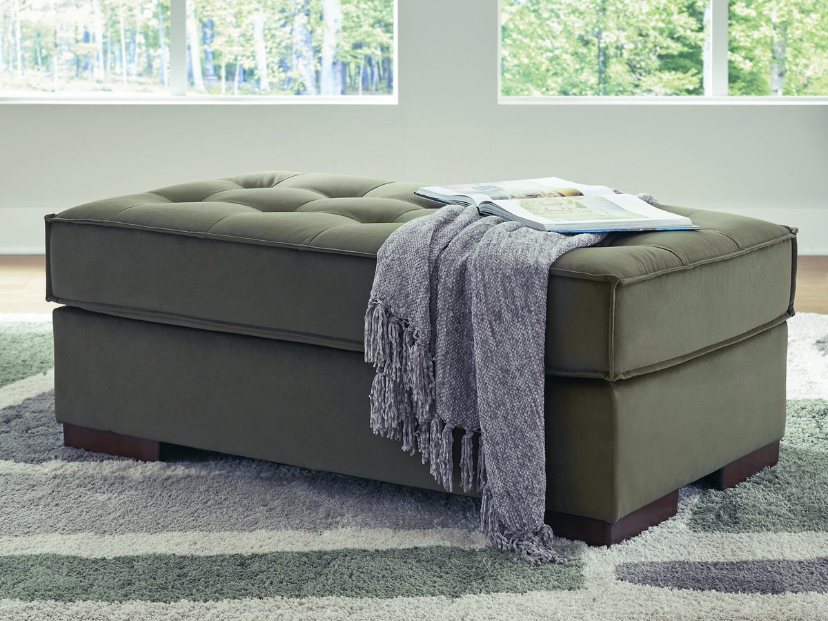 Caspian-Town oversized accent ottoman by Signature Design by Ashley with a plush fabric cover and sturdy wooden legs.