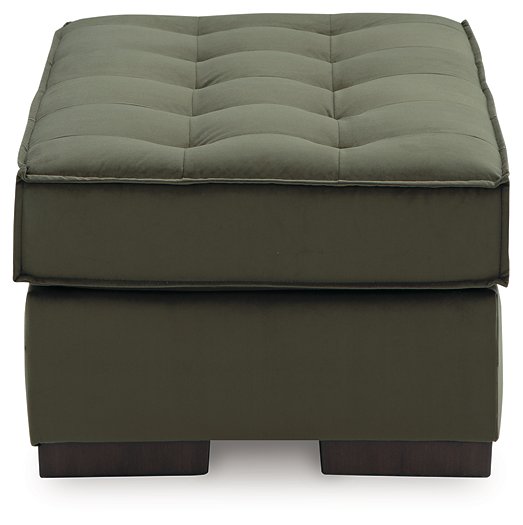 Side view of the Caspian-Town oversized accent ottoman by Signature Design, featuring a plush fabric and sturdy wooden legs.