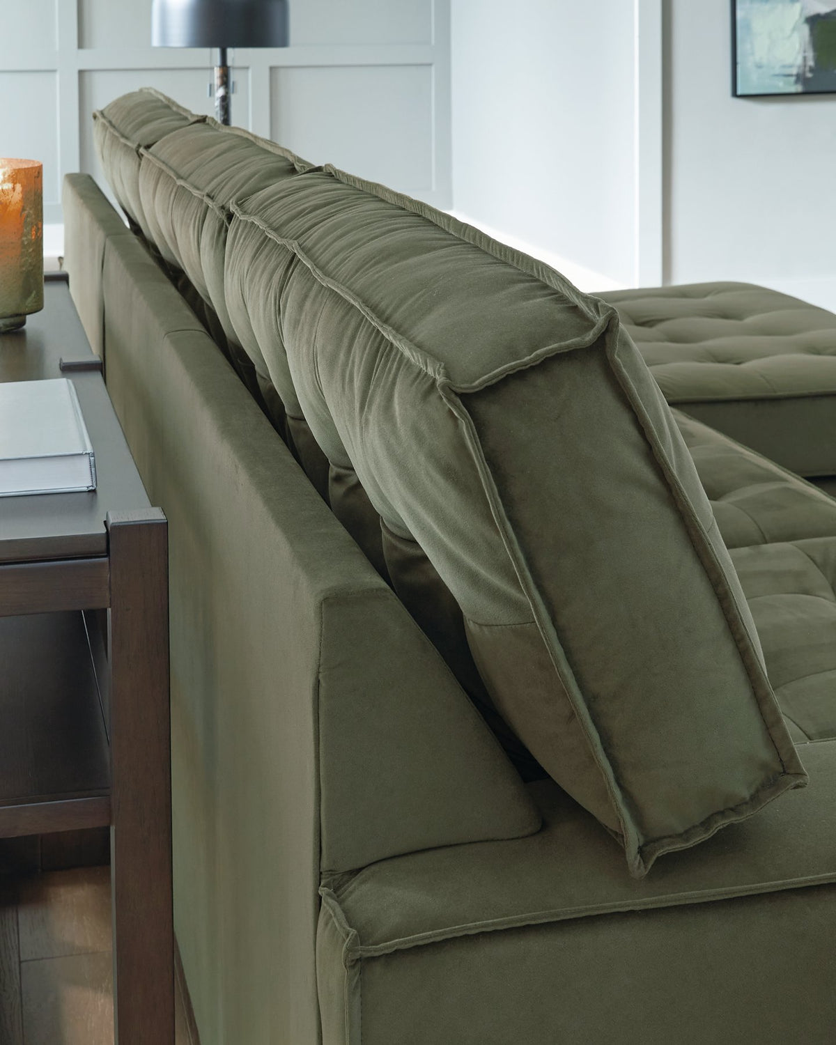 Caspian-Town sectional with chaise by Signature Design Ashley, featuring beige upholstery and detailed welt stitching.