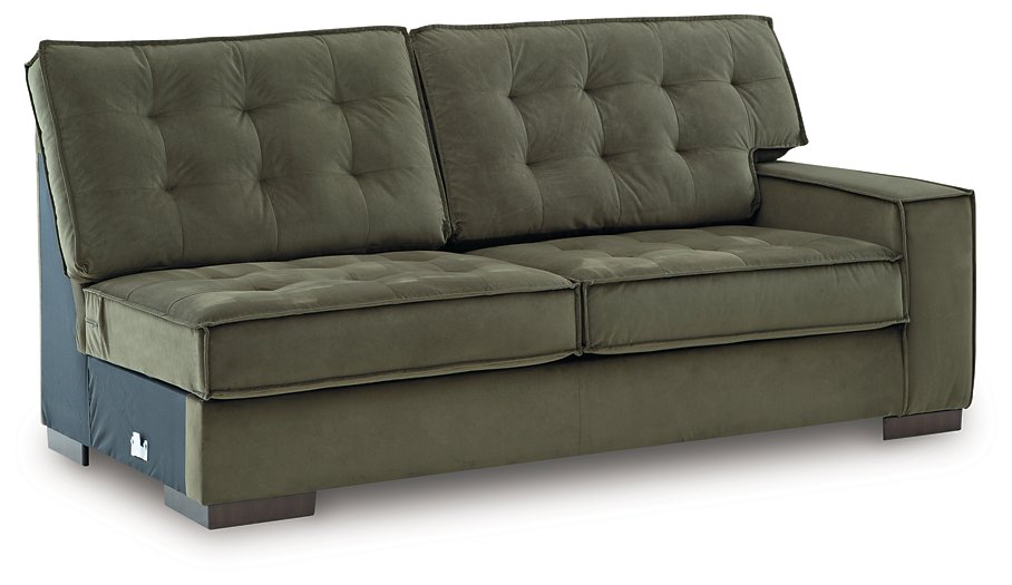 Signature Design by Ashley Caspian-Town sectional with chaise, showing plush upholstery and modern design from an angled view.