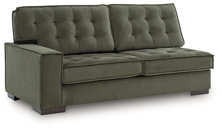 Signature Design by Ashley Caspian-Town sectional with chaise, featuring plush cushions and modern fabric in an angled view.