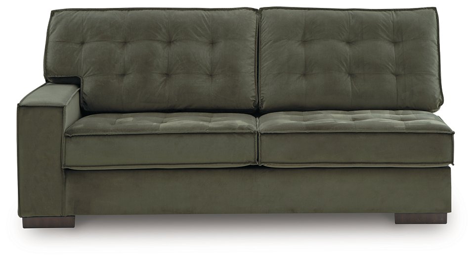 Signature Design by Ashley Caspian-Town sectional with chaise, featuring plush cushions and modern fabric in a stylish living room setting.