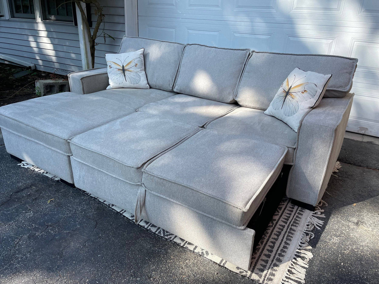 Gray 2 piece sectional with left-facing chaise, storage, and pop-up sleeper - Pull Up A Couch