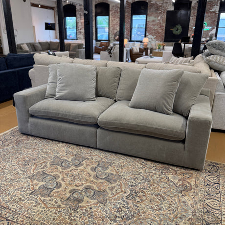 Ashley Furniture Nova Cloud 2-piece modular sofa with plush cushions and modern design, shown in a cozy living room setting.