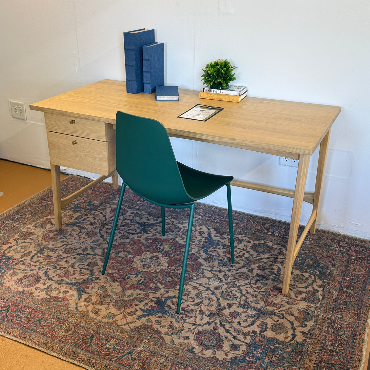White oak 58.5-inch MCM-style desk by Article, featuring a sleek modern design with a spacious work surface.