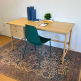 White oak 58.5-inch MCM-style desk by Article, featuring a sleek modern design with a spacious work surface.