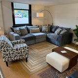 Fusion Barrington 4-piece corner sectional sofa with plush cushions and neutral fabric upholstery on a living room setup.