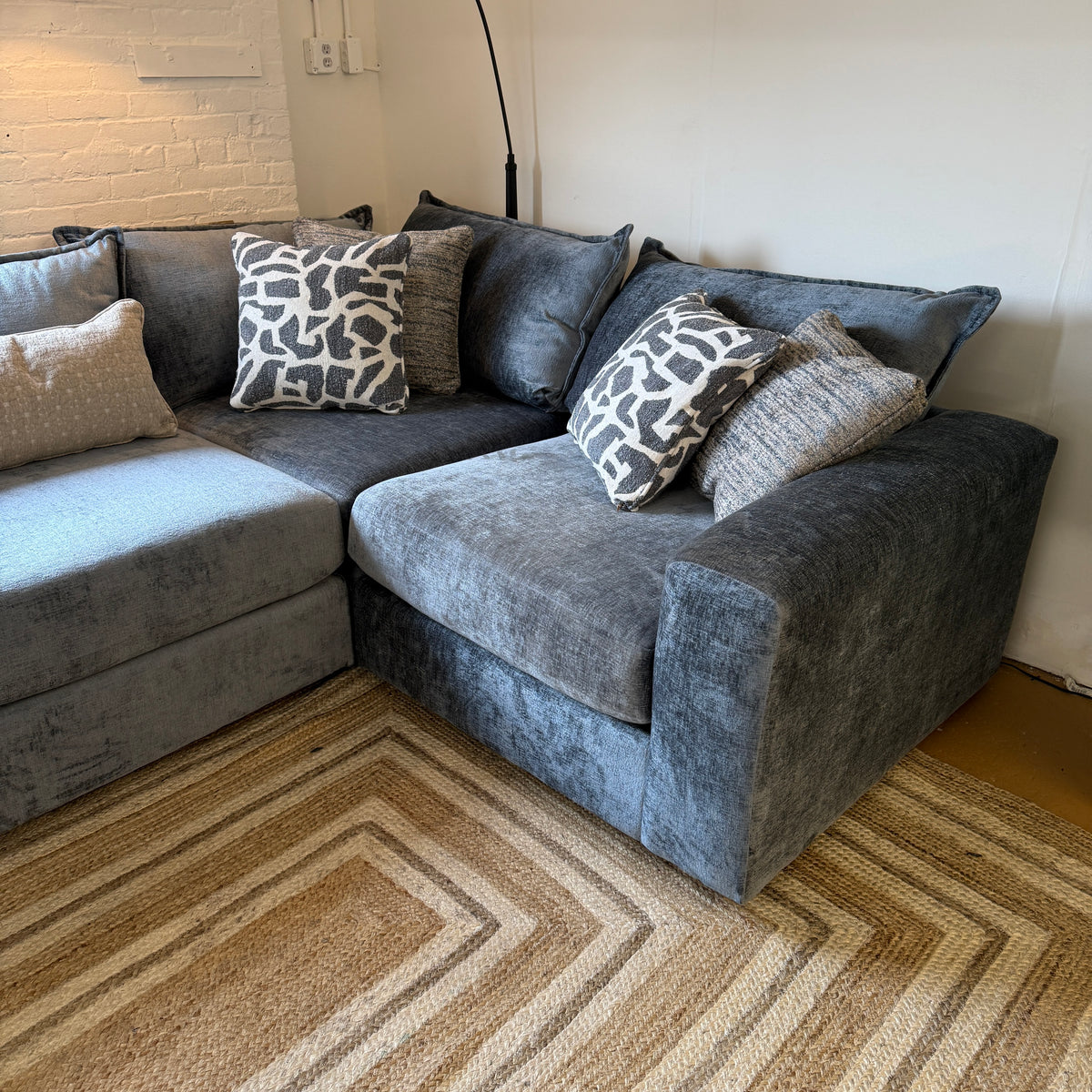 Fusion Barrington 4-piece sectional sofa with modern design, featuring plush cushions and corner seating in a stylish living room setting.