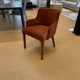 Rust velvet MCM-style armchair by Article with a sleek design, wooden legs, and plush cushioned seat.