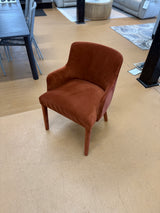 Velvet MCM-style armchair by Article in Hale Rust with a plush, mid-century modern design and curved armrests.