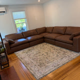 Ashley Furniture Atlas Reserve corner sectional in a cozy living room setting with plush cushions and neutral upholstery.
