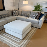Behold Home Sequoia Accent Ottoman with wooden legs and plush fabric, shown as a stylish, versatile furniture piece in a modern living space.