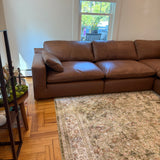 Ashley Furniture Atlas Reserve 5-piece sectional sofa with corner design, plush cushions, and neutral fabric upholstery.