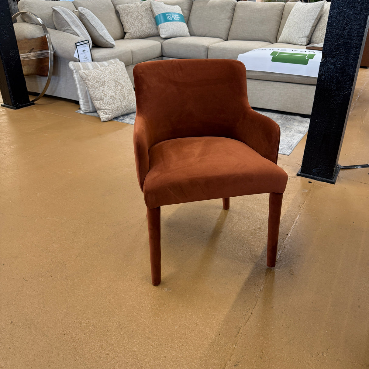 Rust velvet MCM-style armchair by Article with wooden legs, mid-century modern design, shown from a front angle.