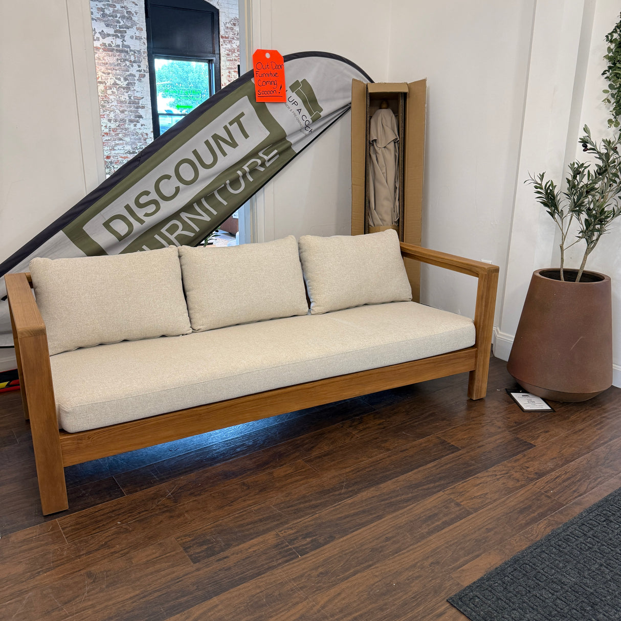 Outdoor sofa in Portside beige by Article, 80-inch outdoor furniture piece with plush cushions and modern design.